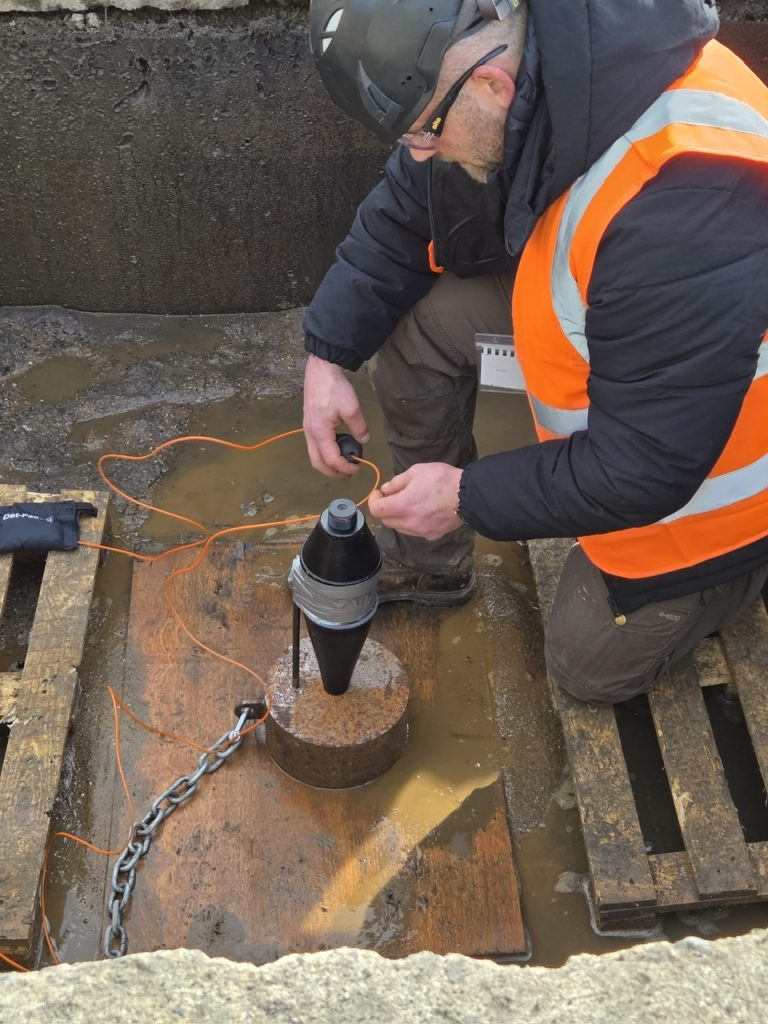 Operator preparing a disruptor in a training pit